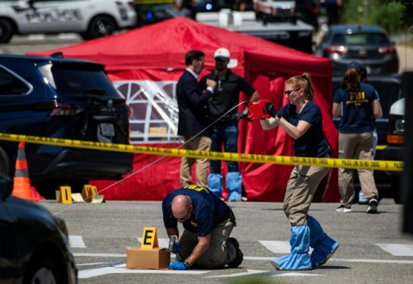 Des enquêteurs du FBI sur les lieux où un homme a été tué par un agent de l'ICE à Biddeford, le 13 juillet 2026 dans le Maine
