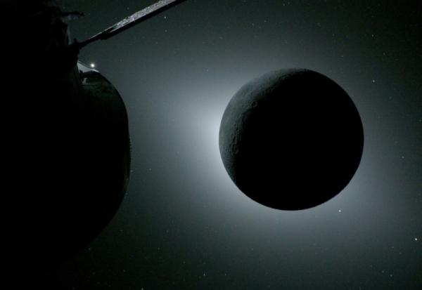 Photo diffusée par la Nasa le 7 avril 2026 montrant le vaisseau spatial Orion (g) et la Lune rétroéclairée par le Soleil lors d'une éclipse solaire, le 6 avril 2026