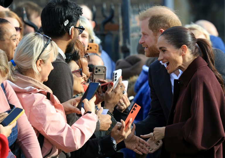 Le prince Harry et son épouse Meghan, duc et duchesse de Sussex, lors d’une visite au 'Himmah Hub