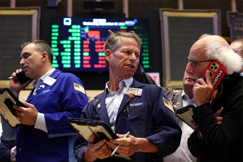 Wall Street dans le vert avec les trimestriels, malgré la guerre commerciale